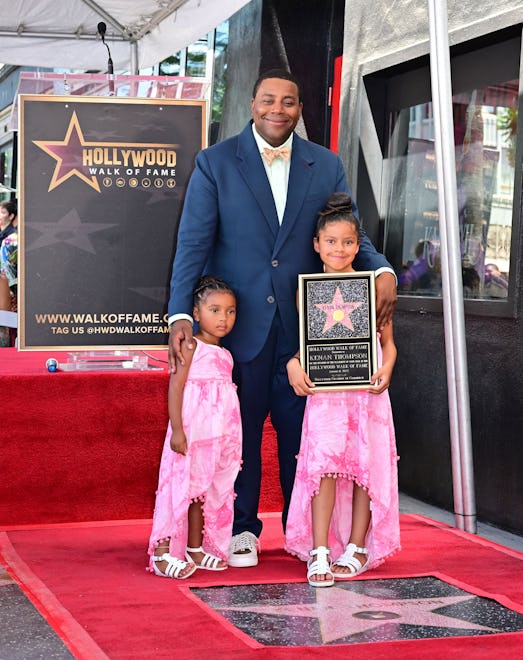 Comedian and actor Kenan Thompson poses on his just unveiled Hollywood Walk of Fame Star with his tw...