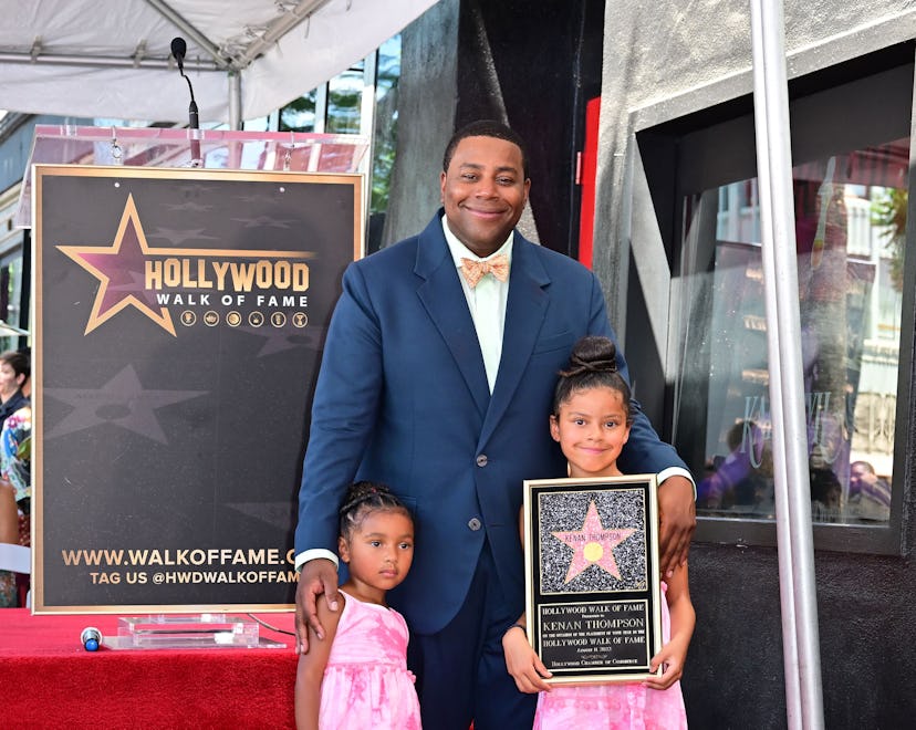 Comedian and actor Kenan Thompson poses on his just unveiled Hollywood Walk of Fame Star with his tw...