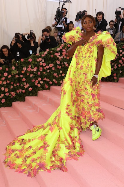 Serena Williams attends the 2019 Met Gala in a yellow gown.