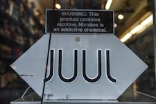 NEW YORK, NY - DECEMBER 19: A sign advertising JUUL products is displayed in a store on December 19,...