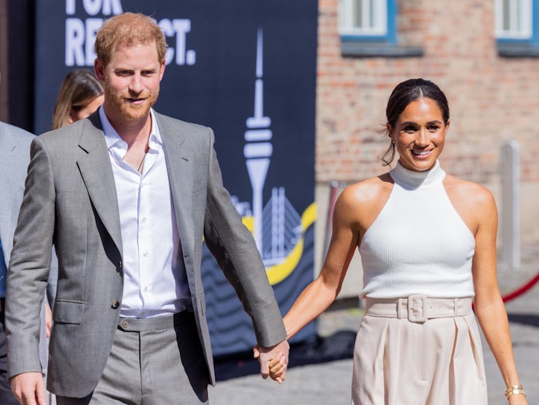 Meghan Markle's 2022 outfits include pleated pants worn during a visit to City Hall in Dusseldorf, G...