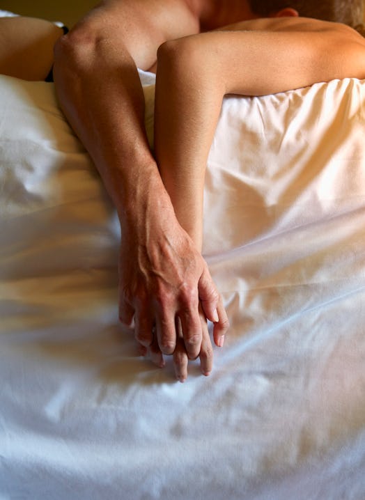 couple in bed together in an article about bleeding after sex