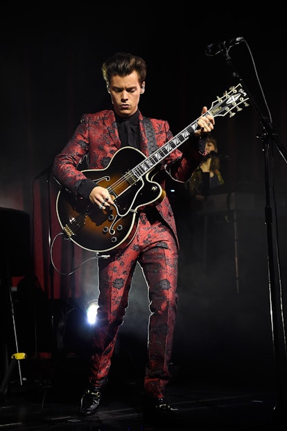 Harry Styles's Style Evolution: the singer wore a custom Gucci suit to perform onstage at Radio City...