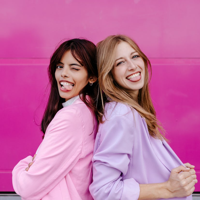 two women back to back make funny faces as they think about their sept. 19, 2022 weekly horoscope