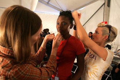 NEW YORK - SEPTEMBER 09:  A model gets hair and make-up done backstage at the Tommy Hilfiger Spring ...