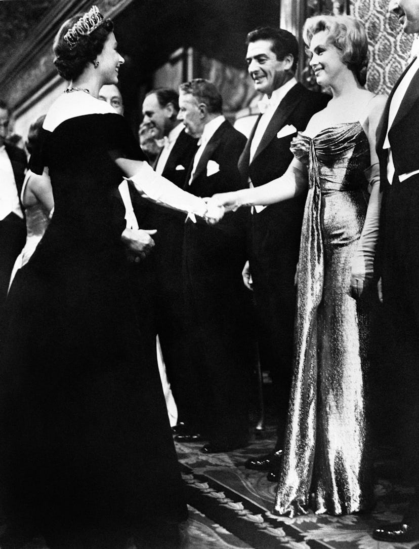 Marilyn Monroe, shaking hands with Queen Elizabeth II on the occasion of the 1956 Royal Film Perform...