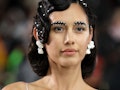 The best NYFW beauty looks include pearl eyebrows as seen on model walking the runway for Deus Ex Ma...