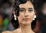 The best NYFW beauty looks include pearl eyebrows as seen on model walking the runway for Deus Ex Ma...