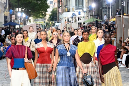 NEW YORK, NEW YORK - SEPTEMBER 12: Models walk the runway during the Tory Burch Spring/Summer 2022 C...