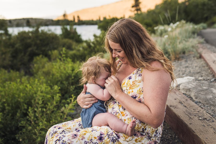 mother nursing an older baby in a guide to how to relactate 