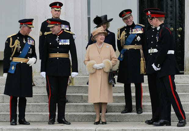 Queen Elizabeth of Britain (C) speaks with her grandson's Prince William (2nd from R) and Prince Har...