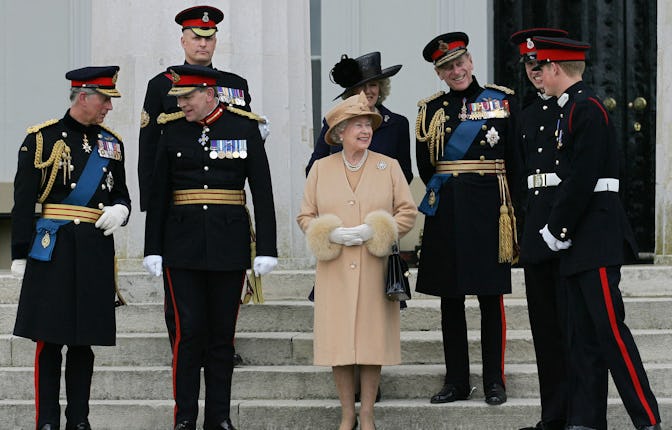 Queen Elizabeth of Britain (C) speaks with her grandson's Prince William (2nd from R) and Prince Har...