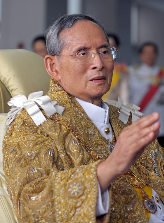 Thai King Bhumibol Adulyadej waves to well-wishers after the royal ceremony for his 83rd birthday in…