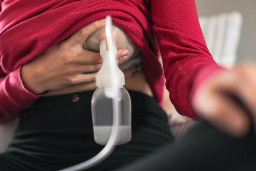 a woman using a breast pump in an article about relactation