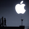 Apple CEO Tim Cook, singer Sia, and dancer Maddie Ziegler leave the stage following an Apple Event t...