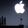 Apple CEO Tim Cook, singer Sia, and dancer Maddie Ziegler leave the stage following an Apple Event t...