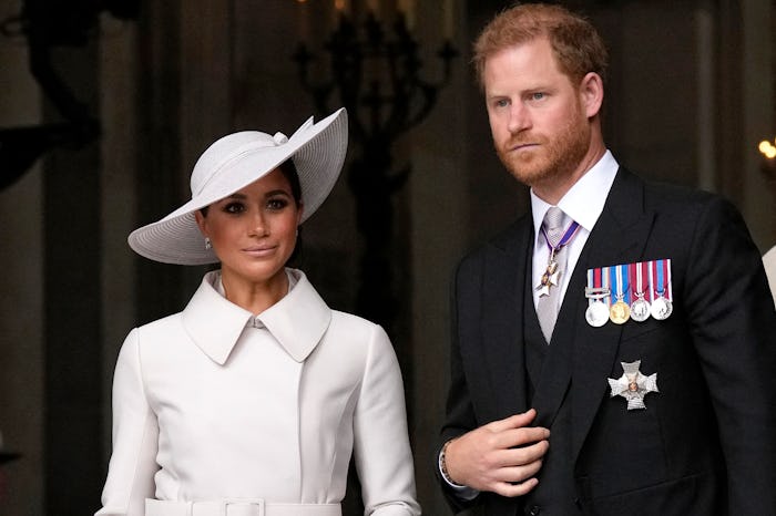 Britain's Prince Harry, Duke of Sussex, and Britain's Meghan, Duchess of Sussex, leave at the end of...