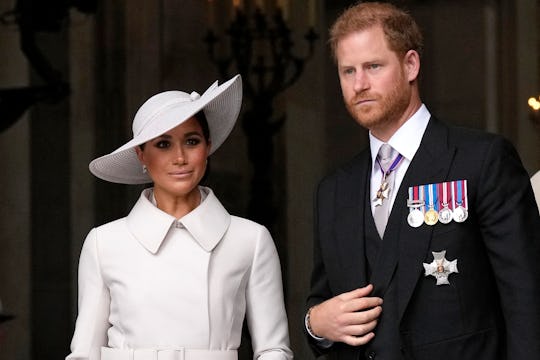 Britain's Prince Harry, Duke of Sussex, and Britain's Meghan, Duchess of Sussex, leave at the end of...