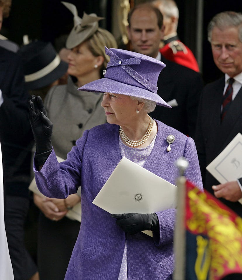 Britain's Queen Elizabeth II waves as she leaves the Service of Thanksgiving for the life of Diana, ...