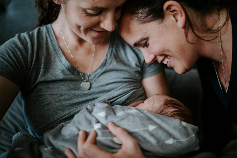 breastfeeding woman with a baby and partner in an article about how long after drinking can you brea...