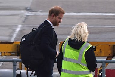 The Duke of Sussex boards a plane at Aberdeen Airport as he travels to London following the death of...