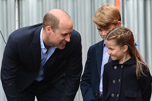 Britain's Prince William, Duke of Cambridge, speaks to his children Britain's Prince George and Brit...