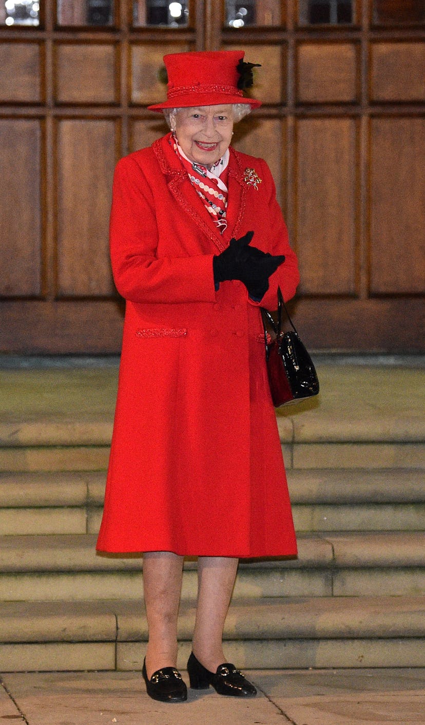 Britain's Queen Elizabeth II reacts as she waits to thank local volunteers and key workers for the w...