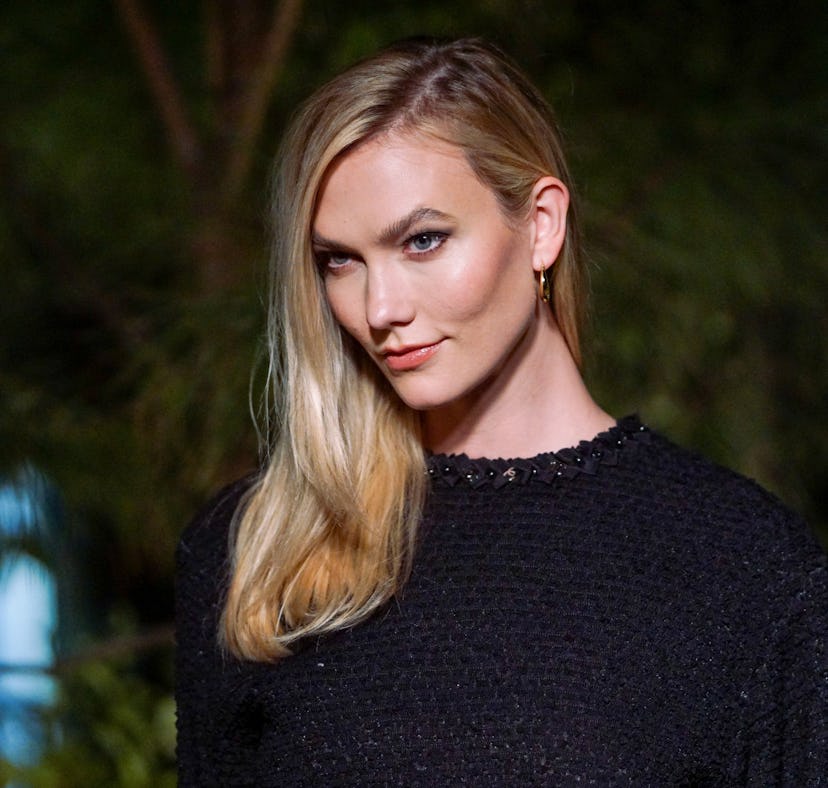 Karlie Kloss' pumpkin spice makeup is different from the makeup she wore to attend the Chanel Dinner...