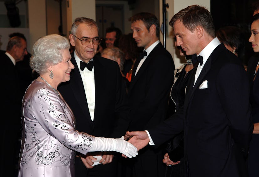 HM Queen Elizabeth II shakes hands with British actor Daniel Craig the new James Bond at the Royal P…