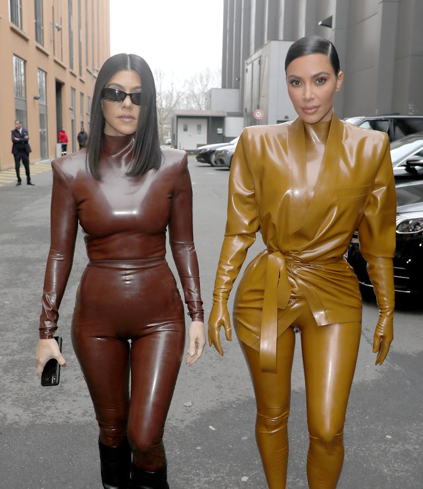 PARIS, FRANCE - MARCH 01: (EDITORIAL USE ONLY) Kourtney and Kim Kardashian attend the Balenciaga sho...