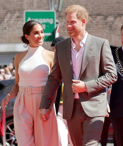 Prince Harry, Duke of Sussex and Meghan, Duchess of Sussex arrive at the town hall during the Invict...