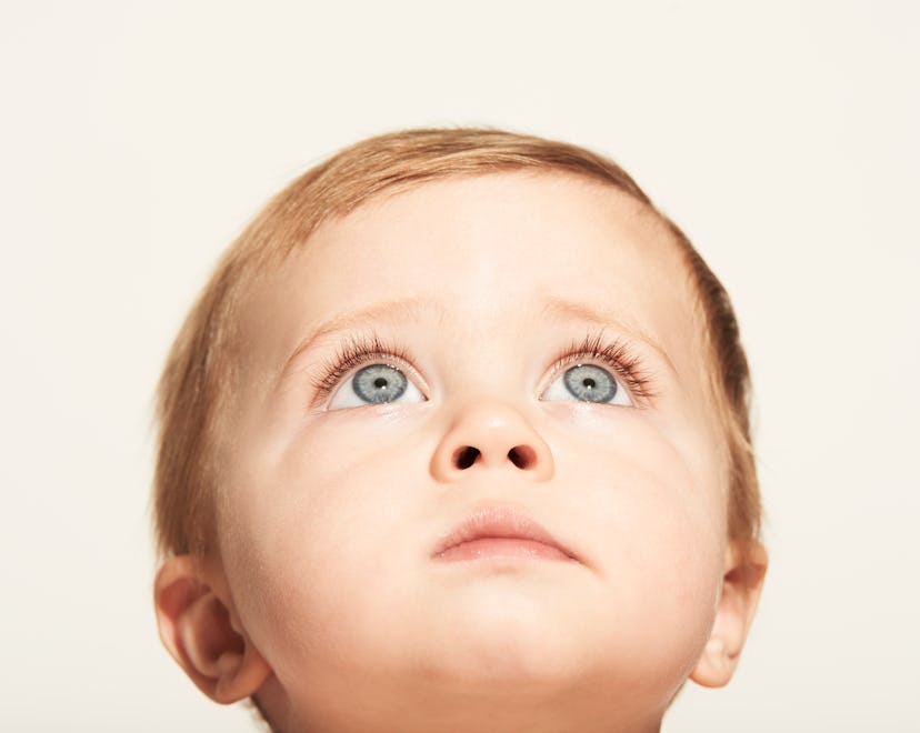 close up of blue eyed baby boy for boy names that start with T