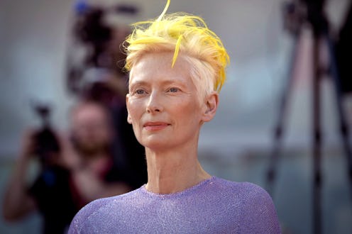 The Hidden Meaning Behind Tilda Swinton’s Neon Yellow Hair At The Venice Film Festival