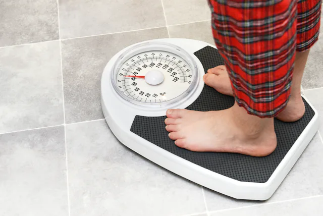 Boy on bathroom scales