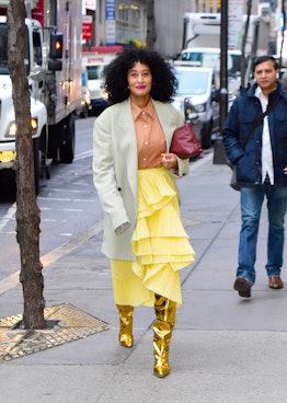 Tracee Ellis Ross wearing gold thigh-high boots from BY FAR.