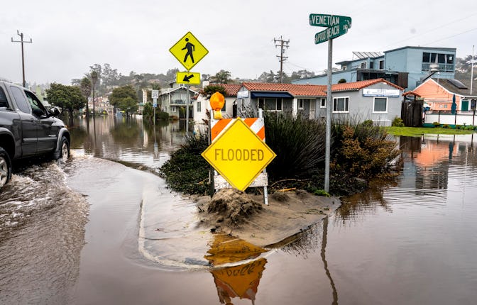 APTOS, CALIFORNIA - JANUARY 9, 2023: Streets and homes are flooded along Aptos Beach Drive near the ...