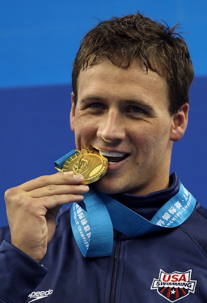 SHANGHAI, CHINA - JULY 26:  Ryan Lochte of the United States poses with his gold medal after the Men...