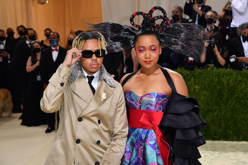 Japanese tennis player Naomi Osaka (R) and US singer Cordae arrive for the 2021 Met Gala at the Metr...