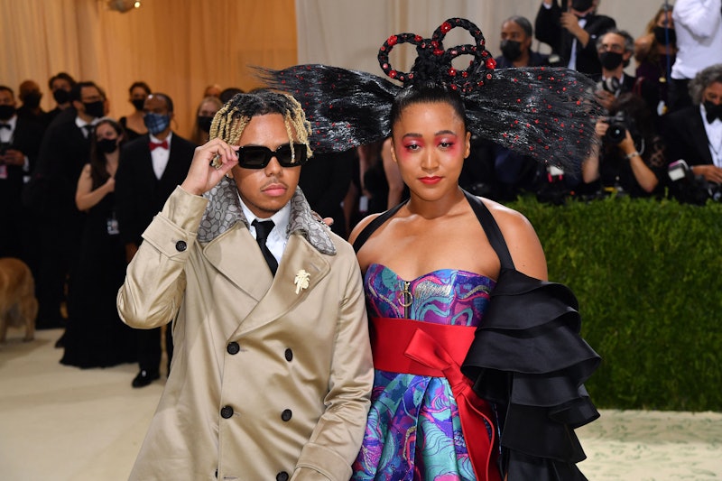 Japanese tennis player Naomi Osaka (R) and US singer Cordae arrive for the 2021 Met Gala at the Metr...