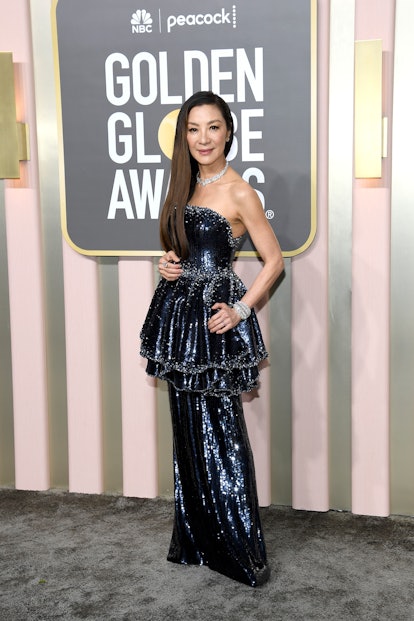 Michelle Yeoh wearing spring 2023 hair color trend warm chestnut at the 80th Annual Golden Globe Awa...