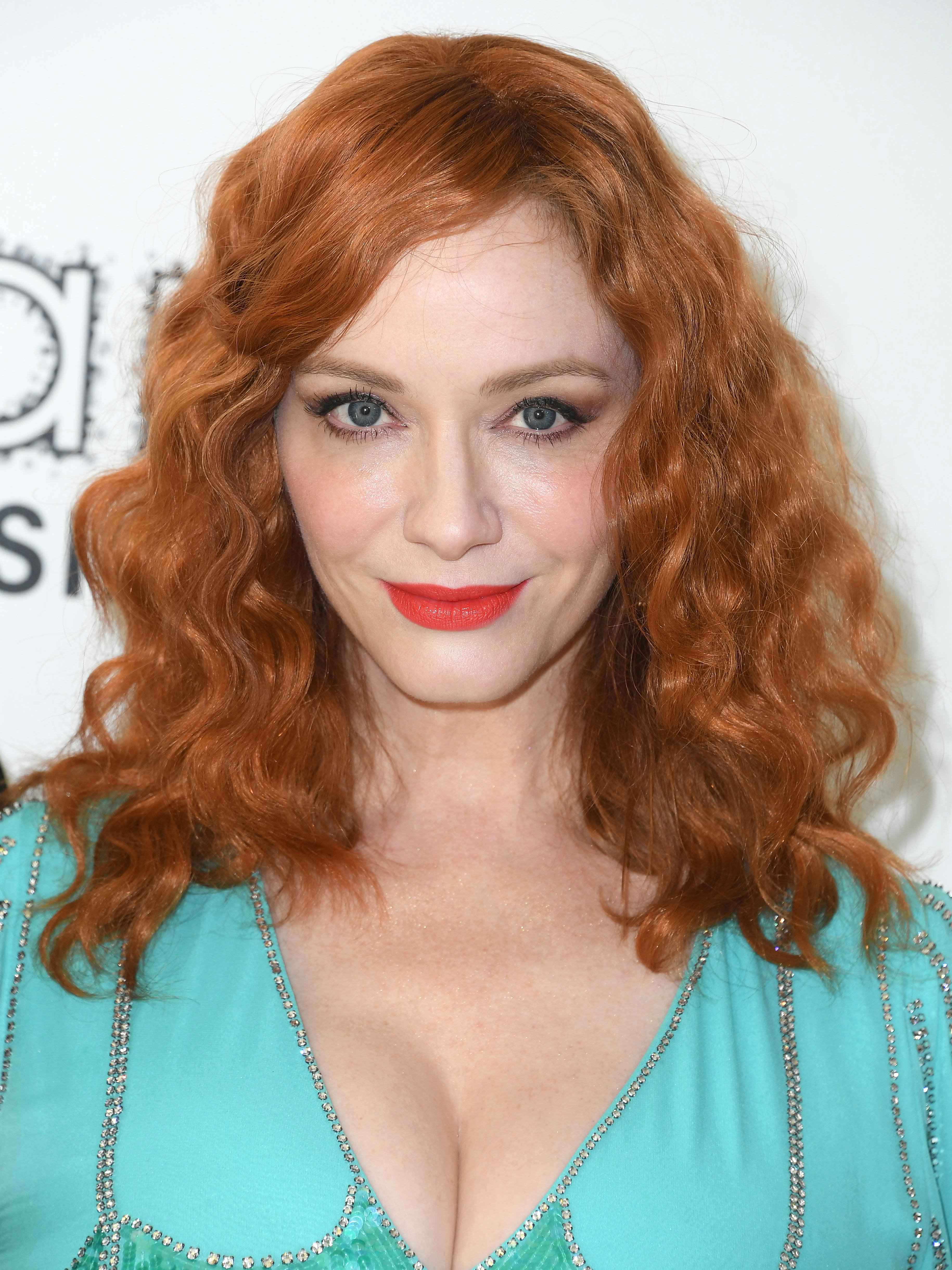 Christina Hendricks in spring 2023 hair color trend bright auburn at the Elton John AIDS Foundation'&hellip;