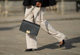 high waist beige wide legs pants with Chanel's black leather boy bag