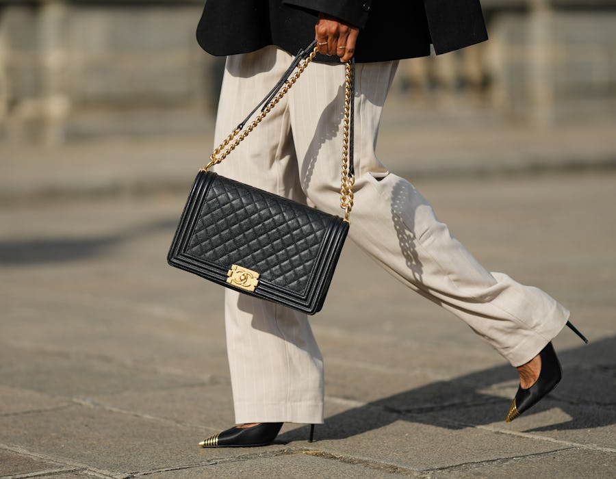 high waist beige wide legs pants with Chanel's black leather boy bag