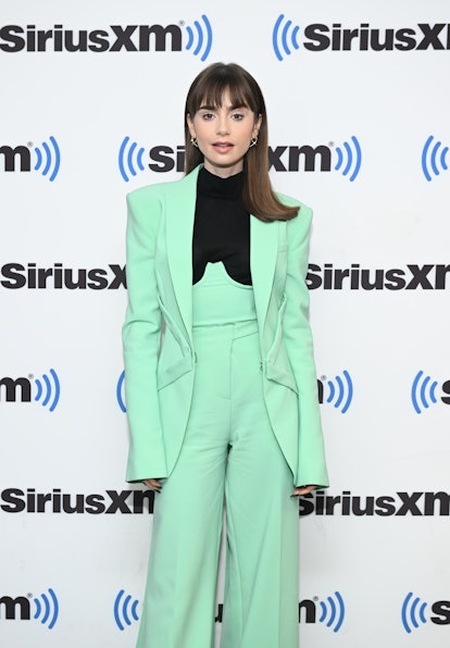 Lily Collins joins the cool-toned brunette trend for spring 2023 hair color at Sirius XM's Town Hall...