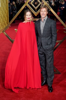 Margot Robbie and Brad Pitt attending the premiere of Babylon 