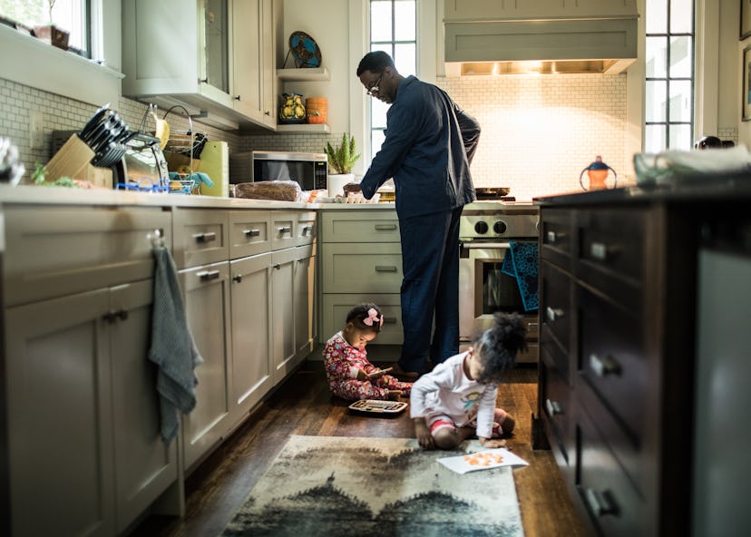 Father cooking breakfast for daughters in kitchen in an article about gas stoves cause asthma?
