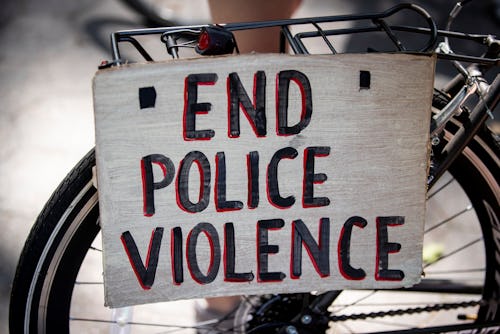 BROOKLYN, NY - July 25: A protester's bicycle has a sign attached to the back that says, "End Police...