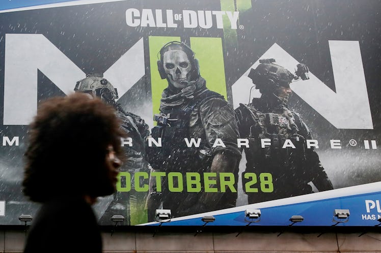 NEW YORK, NEW YORK - DECEMBER 7: A man walks near Call of Duty game publicity on December 7, 2022 in...