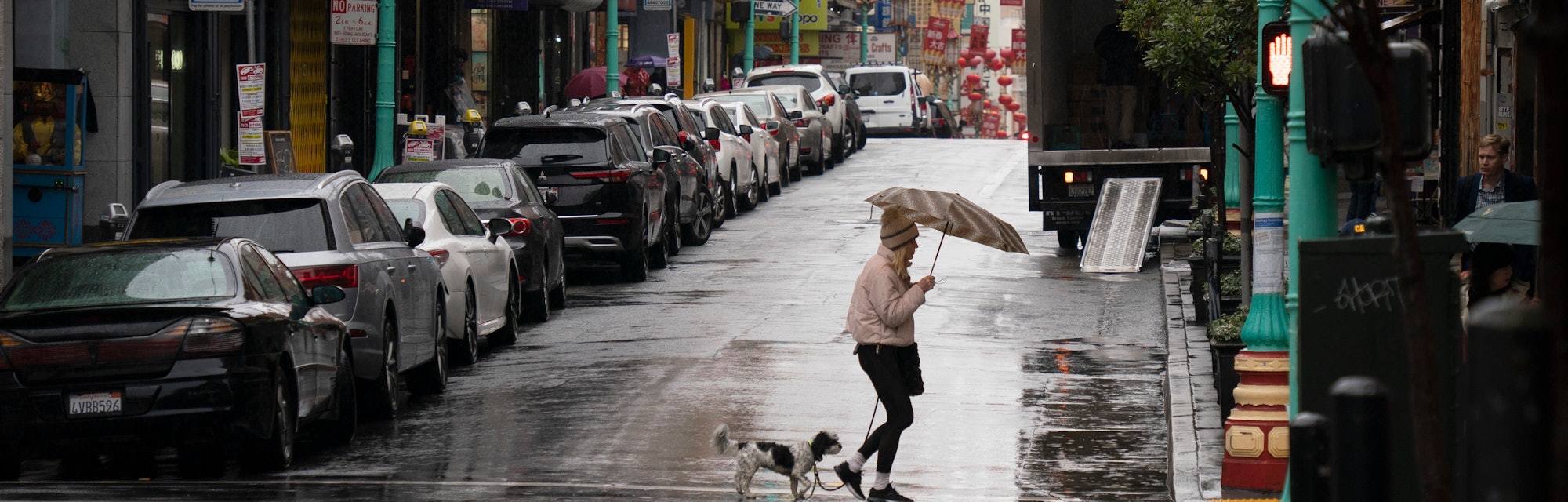 SAN FRANCISCO, CALIFORNIA - JANUARY 11: A resident with an umbrella walks amid a rain on January 11,...