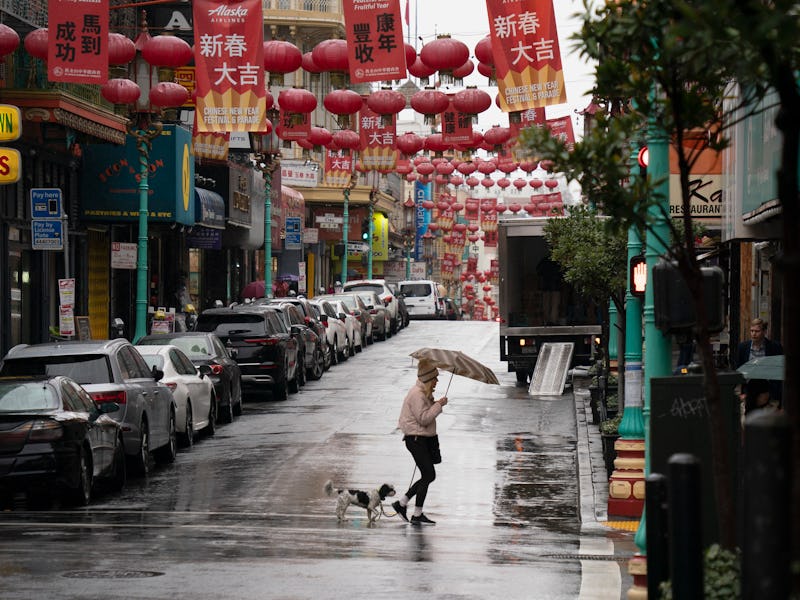 SAN FRANCISCO, CALIFORNIA - JANUARY 11: A resident with an umbrella walks amid a rain on January 11,...